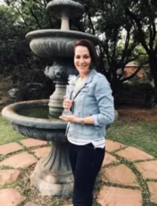 Author Didi Potgieter holding the Imbali Award