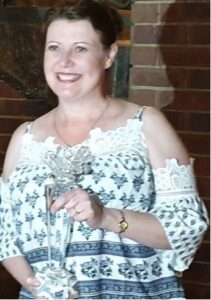 Author Leandra Naude holding the Imbali Award